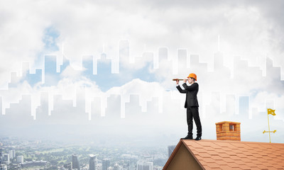 Engineer man standing on roof and looking in spyglass. Mixed media