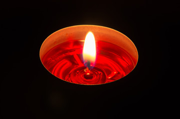 Burning red aromatic candle.