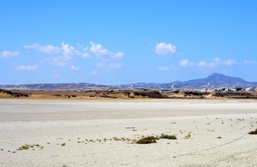 Outdoor landscape of Stavrovouni mountain with salt lake and cloudy blue sky