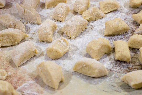 Raw kopytka or kapytki. Polish traditional potato dumpling.
