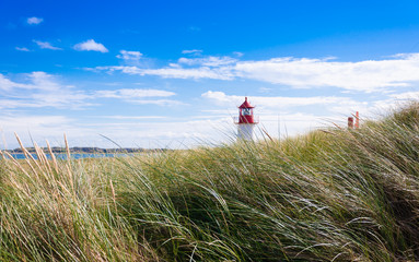 Fototapeta na wymiar Lighthouse near Kampen on the island of Sylt, Germany