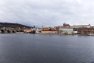 Fototapeta na wymiar View on the autumn Prague gothic Castle above River Vltava, Czech Republic
