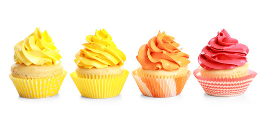 Tasty colorful cupcakes on white background