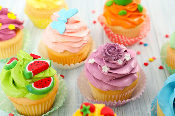 Beautiful cupcakes on wooden table