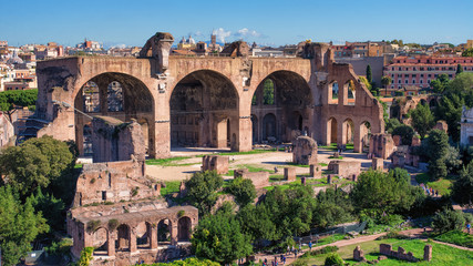 Red stone Basilica of Maxentius with arcs in Rome, Italy - 181987210