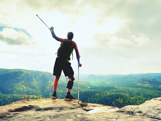 Man with a crutches and fixed broken leg on crutches. Traveler with hurt leg in bandages stay on...