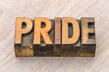 pride word abstract in wood type