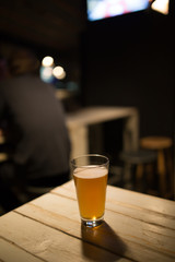 Craft beer on wood table in a pub