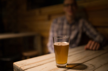 Man in a pub in front of craft beer