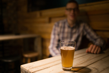 Man in a pub in front of craft beer