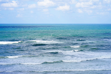 Fototapeta premium Beautiful wave on the beach. Early morning and strong wind. Cloudy morning.