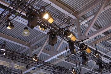 Lighting on farms over the stage in the theater.
