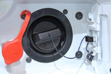 Open hatch of the car gas tank.