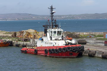 Orange rescue or coast guard patrol boat in blue sea water