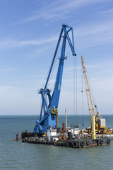 Fototapeta premium crane barge doing marine heavy lift installation works in the gulf or the sea