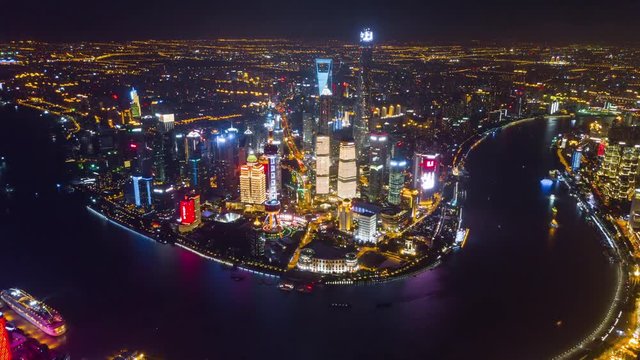 night illuminated famous shanghai pudong downtown cityscape extra high aerial panorama 4k china
