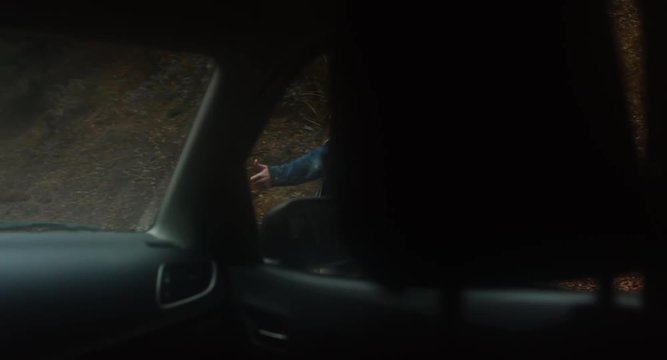 POV Car driver stops to pick hitchhiking girl on a forest road in mountains. 4K UHD 60 FPS SLO MO