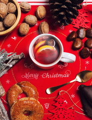 Cup of hot tea on the Christmas table.