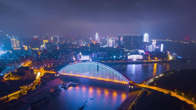 night time illuminated wuhan cityscape qingchuan bridge hanshui river aerial panorama 4k china
