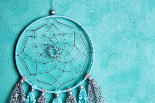 Dream Catcher On Aquamarine Wall Background