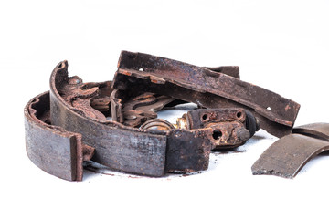 Old used break shoes on the white background