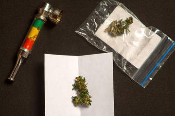Naklejka na ściany i meble hemp oil in a bubble with marijuana buds and cannabis seeds