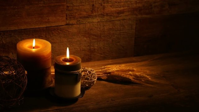 This is a close-up video symbolizing Thanksgiving, fall, autumn, using a still life setting inside a barn background made up of old red wood.There's a lot of space for a copy In this video. 