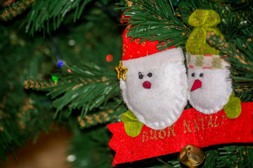 Close Up of Homemade Red and White Elf of Cloth Decorations  On the Christmas Tree