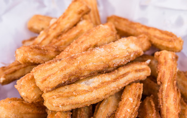 Close up of traditional Spanish churros dessert at a street food market