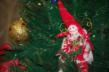 Close Up of Homemade Red and White Elf of Cloth Decorations  On the Christmas Tree