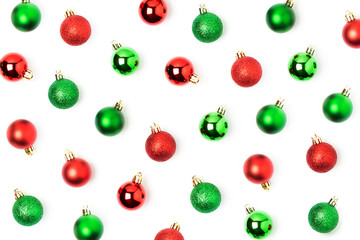 Holiday pattern  made of red and green Christmas balls on white background. Flat lay, top view