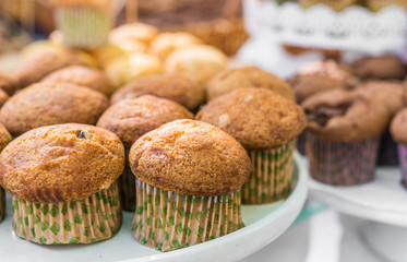 Close up photo of muffins at a street food market. Selective focus