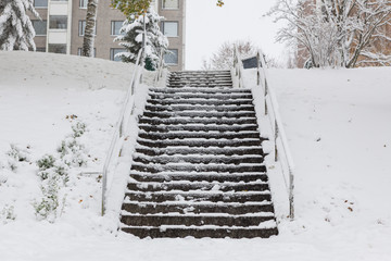 Slippery stairs after first snow in city park - 182001012