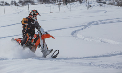 Enduro Snowbike Snowmobile journey with dirt bike high in the mountains