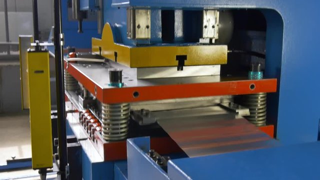 Cutting holes perforation stamping of metal sheets on industrial CNC machine. Automation of work. Refrigeration and ventilation equipment and air conditioners. Modern technologies. 4k.