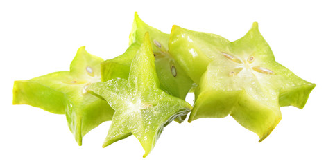 Slices of unripe green carambola or starfruit isolated on white background
