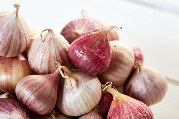 Fresh healthy garlic on white table