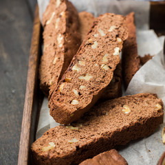 Classic chocolate Italian biscotti with nuts in a wooden vintage box. Copy Space. View blank space for text. Place for text. Food photo.  top view