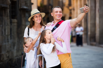 Travelers family taking selfie