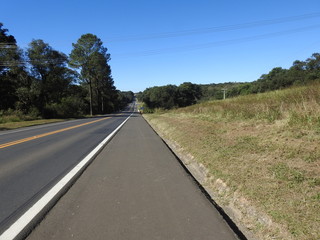 straight and long road, going to the horizon, showing the way home. Road to home, road to home, road tiring.