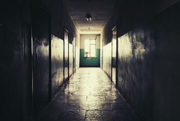 Dark long corridor with doors