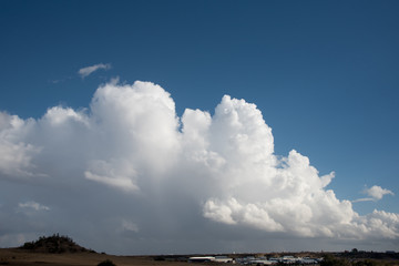 Fototapeta na wymiar White cumulus dramatic clouds