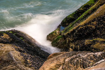 wave pounding sea shore at long exposure