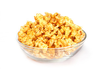 A bowl of sweet caramel popcorn isolated on white 