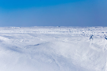 Fototapeta na wymiar Snow and blue sky on nature as background