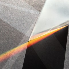 Sunlight through prism scattering in rainbow, light shapes and shadows