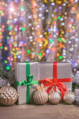 Christmas and New Year, gifts with blurred background of garlands close up  with free copy space