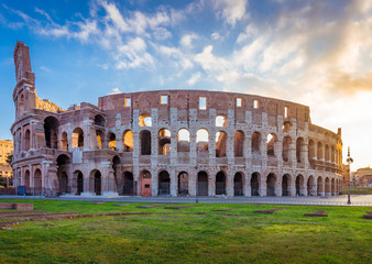 Obraz na płótnie Canvas View of Colosseum in Rome and morning sun, Italy, Europe.