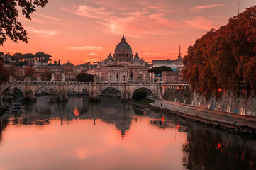 Beautiful view over St Peter's basilica and Vatican from the bridge Umberto I in Rome, Italy on a sunset - obrazy, fototapety, plakaty