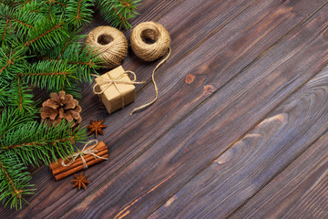 christmas present box. fir branches with cinnamon and anise on rustic wooden background. flat lay. seasonal greetings concept. winter holidays concept